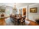 Formal dining room with hardwood floors, chandelier, and large table at 830 Camden Park Ne Ct, Atlanta, GA 30342
