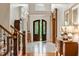 Grand two-story entry with hardwood floors and wood staircase at 830 Camden Park Ne Ct, Atlanta, GA 30342
