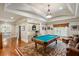 Game room with a pool table, seating area, and built-in entertainment center at 830 Camden Park Ne Ct, Atlanta, GA 30342