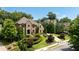 Elegant two-story home with stone accents and manicured landscaping at 830 Camden Park Ne Ct, Atlanta, GA 30342