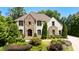 Beautiful home with light-colored brick and stone exterior at 830 Camden Park Ne Ct, Atlanta, GA 30342