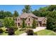 Stunning home with stone and brick exterior, and lush landscaping at 830 Camden Park Ne Ct, Atlanta, GA 30342