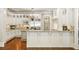 Modern kitchen with white cabinetry, granite countertops, and breakfast bar at 830 Camden Park Ne Ct, Atlanta, GA 30342