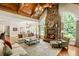 Living room features a stone fireplace, high ceilings, and ample natural light at 830 Camden Park Ne Ct, Atlanta, GA 30342