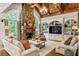 Spacious living room with stone fireplace, built-in shelving, and hardwood floors at 830 Camden Park Ne Ct, Atlanta, GA 30342