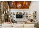 Grand living room with vaulted ceilings, stone fireplace, and built-in shelving at 830 Camden Park Ne Ct, Atlanta, GA 30342