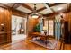 Spacious home office with wood paneling, fireplace, and built-in shelves at 830 Camden Park Ne Ct, Atlanta, GA 30342