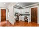 Home office with built-in desks, cabinets, and hardwood floors at 830 Camden Park Ne Ct, Atlanta, GA 30342