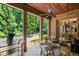 Covered porch with access to the pool and backyard at 830 Camden Park Ne Ct, Atlanta, GA 30342