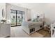 bedroom with a white bed, built-in storage, and balcony access at 1494 Red Fox Ne Dr # D, Atlanta, GA 30306