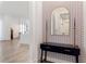 Bright entryway with stylish console table and patterned wallpaper at 1494 Red Fox Ne Dr # D, Atlanta, GA 30306