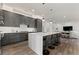 Contemporary kitchen with gray cabinets, white countertops, and an island with seating at 1494 Red Fox Ne Dr # D, Atlanta, GA 30306