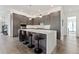 Modern kitchen featuring gray cabinets, white countertops, and a large island at 1494 Red Fox Ne Dr # D, Atlanta, GA 30306