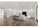 Open living space with hardwood floors, comfortable seating, and a media console at 1494 Red Fox Ne Dr # D, Atlanta, GA 30306