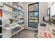 Home office with built-in shelving, large window, and desk at 1494 Red Fox Ne Dr # D, Atlanta, GA 30306
