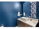 Modern powder room featuring a white sink and blue walls at 1494 Red Fox Ne Dr # D, Atlanta, GA 30306
