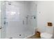 Large walk-in shower with glass enclosure and built-in seat at 1494 Red Fox Ne Dr # D, Atlanta, GA 30306