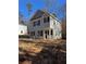 Two-story house with gray siding, black shutters, and a front yard at 2435 Valient Dr, Cumming, GA 30041