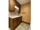 Bathroom with wood vanity, oval mirror, and tile floor at 3639 Holly Springs Rd, Rockmart, GA 30153