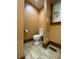 Small bathroom with toilet and tile floor at 3639 Holly Springs Rd, Rockmart, GA 30153