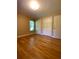 Bright bedroom with hardwood floors and double closets at 3639 Holly Springs Rd, Rockmart, GA 30153