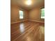 Spacious bedroom with hardwood floors and large windows at 3639 Holly Springs Rd, Rockmart, GA 30153