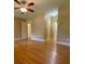 Hardwood floor bedroom with ceiling fan and access to hallway bath at 3639 Holly Springs Rd, Rockmart, GA 30153