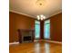 Bright dining room with hardwood floors, fireplace, and large windows at 3639 Holly Springs Rd, Rockmart, GA 30153