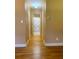 Hardwood floor hallway with access to bathroom and bedrooms at 3639 Holly Springs Rd, Rockmart, GA 30153