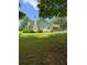 Side view of white house with green roof and manicured lawn at 3639 Holly Springs Rd, Rockmart, GA 30153