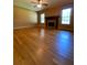 Bright living room with hardwood floors and fireplace at 3639 Holly Springs Rd, Rockmart, GA 30153