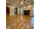 Spacious living room with hardwood floors and a fireplace at 3639 Holly Springs Rd, Rockmart, GA 30153