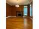 Spacious living room featuring hardwood floors and a fireplace at 3639 Holly Springs Rd, Rockmart, GA 30153