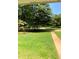 Landscaped yard with walkway and green grass at 3639 Holly Springs Rd, Rockmart, GA 30153