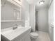 Clean bathroom, featuring a shower, toilet and vanity at 620 Sheringham Ct, Roswell, GA 30076