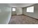 Bedroom with carpet, window, and double-door closet at 620 Sheringham Ct, Roswell, GA 30076