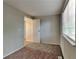 Spacious bedroom with neutral walls and brown carpet at 620 Sheringham Ct, Roswell, GA 30076