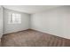 Spacious bedroom with neutral walls and carpet at 620 Sheringham Ct, Roswell, GA 30076