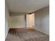 Well-lit bedroom with carpet and access to another room at 620 Sheringham Ct, Roswell, GA 30076