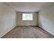 Spacious bedroom with neutral walls and carpeting at 620 Sheringham Ct, Roswell, GA 30076