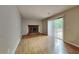 Living room with hardwood floors, fireplace and sliding glass door to backyard at 620 Sheringham Ct, Roswell, GA 30076