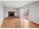 Living room with hardwood floors, fireplace and sliding glass doors at 620 Sheringham Ct, Roswell, GA 30076