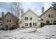 Spacious backyard with snow covered ground and patio at 646 Lakes Cir, Lithonia, GA 30058