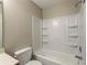 Clean bathroom with shower/tub combo and built-in shelving at 646 Lakes Cir, Lithonia, GA 30058