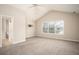 Bright bedroom featuring a large window and ceiling fan at 646 Lakes Cir, Lithonia, GA 30058