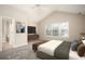 Bright bedroom with vaulted ceilings, a bed, a ceiling fan, and a view to the ensuite bathroom at 646 Lakes Cir, Lithonia, GA 30058