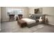 Comfortable bedroom with a plush rug, a queen bed, accent chairs, and lots of natural light at 646 Lakes Cir, Lithonia, GA 30058