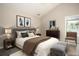 Inviting bedroom features a plush bed, a full size bed, and a window providing natural light at 646 Lakes Cir, Lithonia, GA 30058