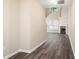 Bright entryway with dark gray vinyl flooring and view to living room at 646 Lakes Cir, Lithonia, GA 30058