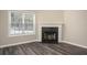 Simple fireplace with a dark stone hearth at 646 Lakes Cir, Lithonia, GA 30058